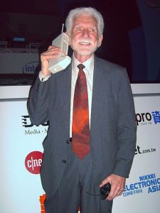 Martin Cooper showing off the first handheld mobile phone, released in 1973. 